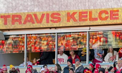 Taylor Swift arrived late to the Browns vs. Chiefs game, unaware that Travis Kelce had a surprise waiting. After the Chiefs' victory, Kelce proposed in front of her parents and cheering fans. Swift, emotional, said "Yes!" as the crowd erupted.