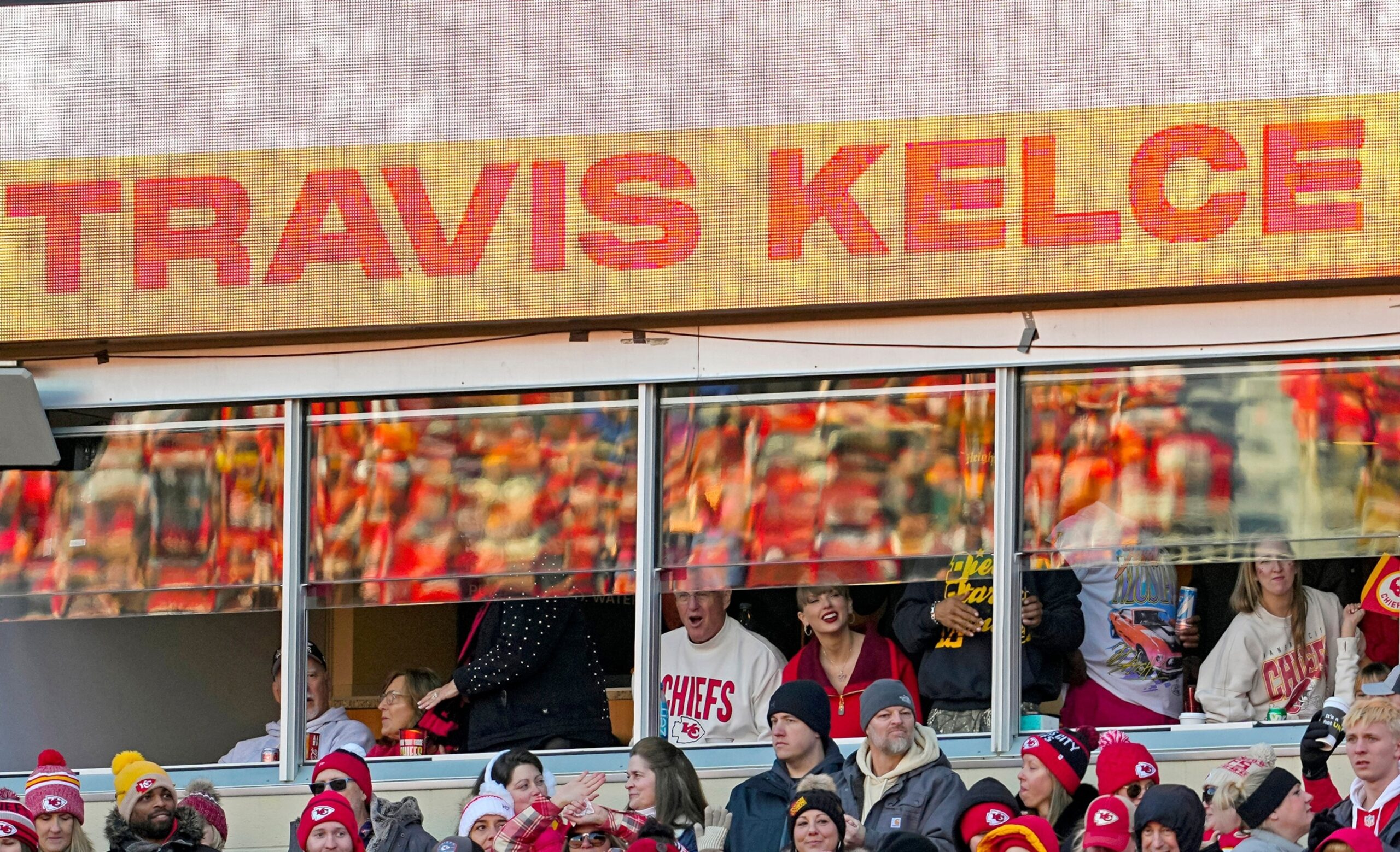 Taylor Swift arrived late to the Browns vs. Chiefs game, unaware that Travis Kelce had a surprise waiting. After the Chiefs' victory, Kelce proposed in front of her parents and cheering fans. Swift, emotional, said "Yes!" as the crowd erupted.